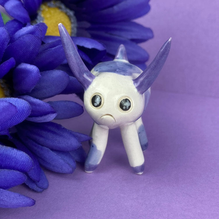 Photo of the handmade clay figures cosmic deer available in Politely Declining shop