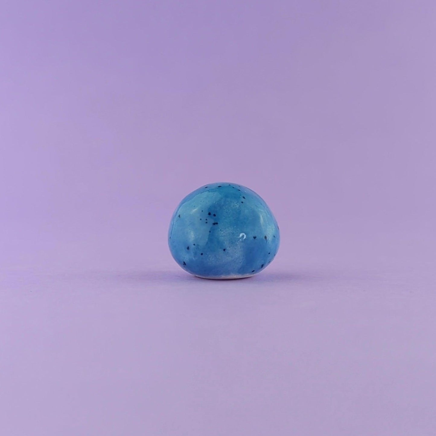 Kymi - Handmande Tiny Blue Figurine Politely Declining - Back