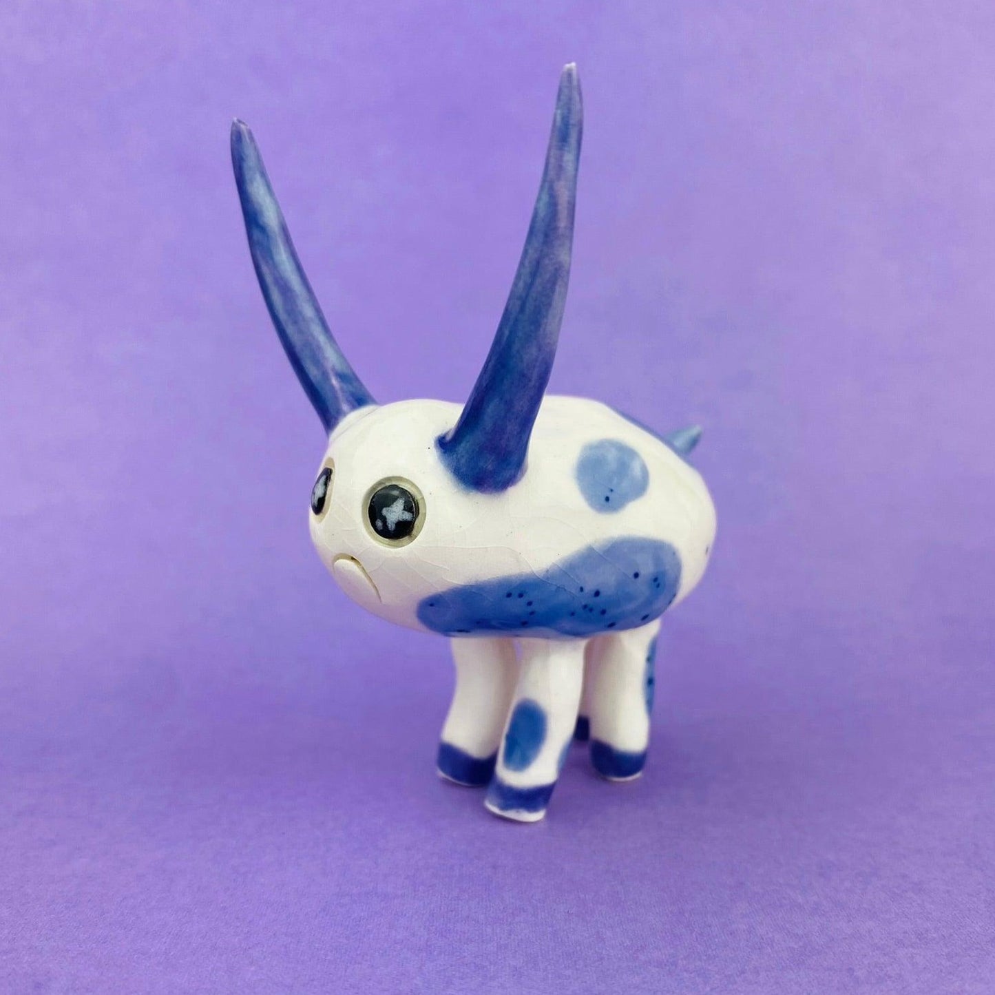 Cosmic Deer - Handmade Purple Cow Figurine Politely Declining