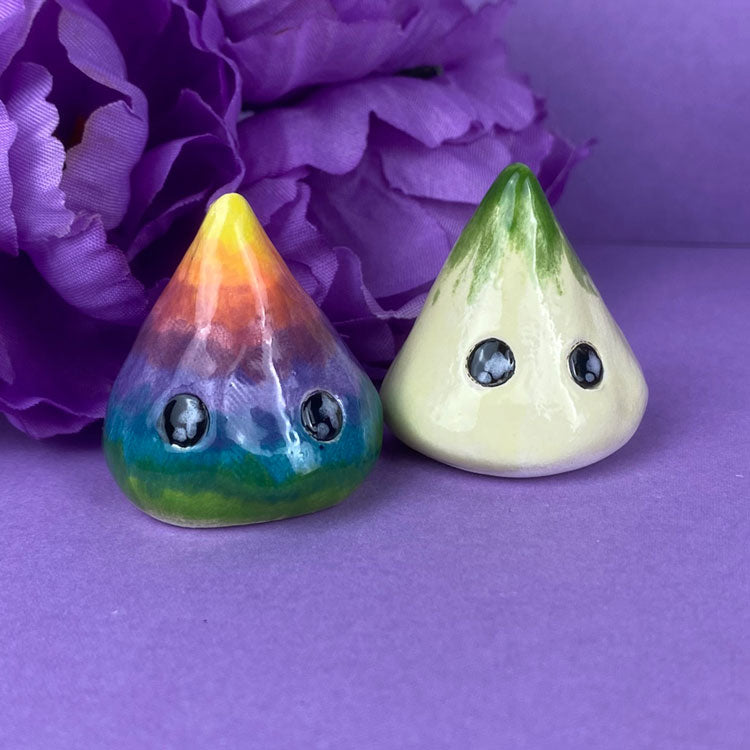 Photo of the handmade clay figures larmy rainbow and onion available in Politely Declining shop
