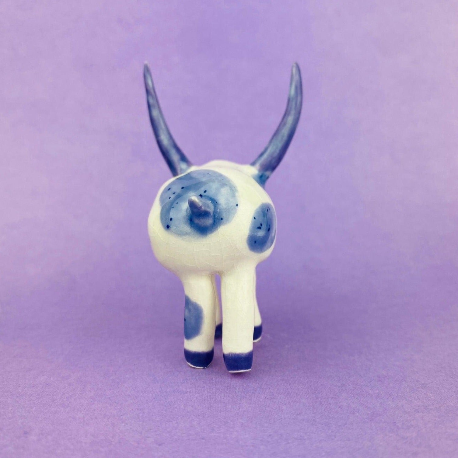 Cosmic Deer - Handmade Purple Cow Figurine Politely Declining